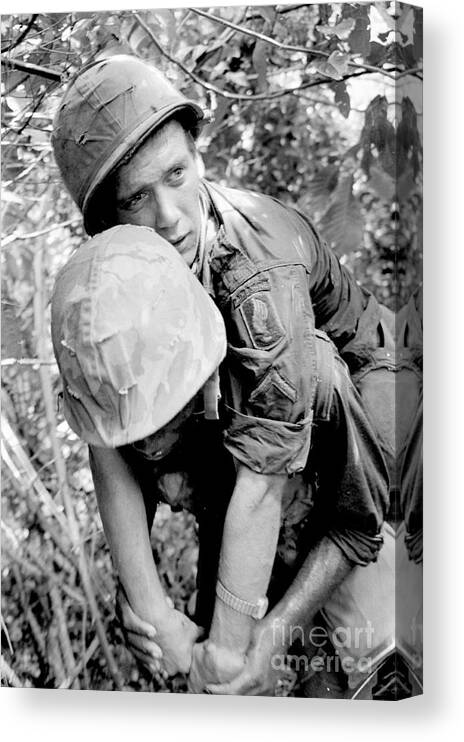 Ho Chi Minh City Canvas Print featuring the photograph Wounded American Soldier by Bettmann