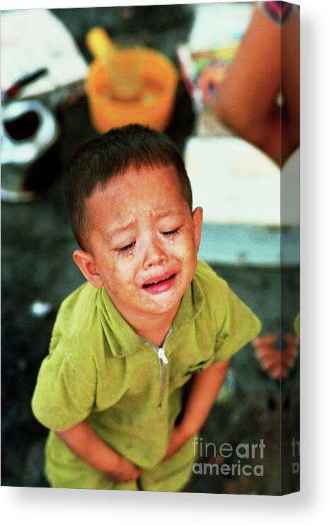 Ho Chi Minh City Canvas Print featuring the photograph Young Vietnamese Boy Crying by Bettmann