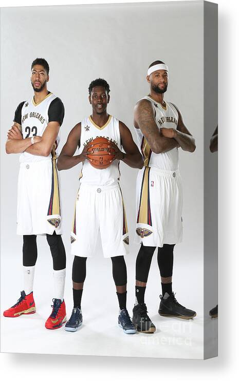 Jrue Holiday Canvas Print featuring the photograph Demarcus Cousins, Jrue Holiday, and Anthony Davis by Layne Murdoch
