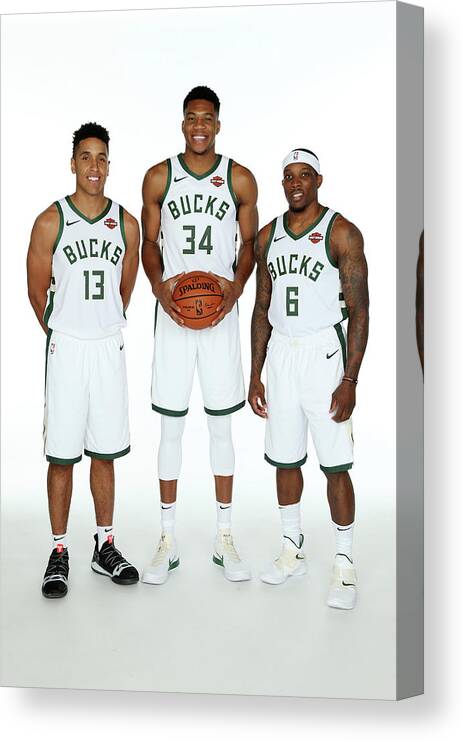Malcolm Brogdon Canvas Print featuring the photograph Malcolm Brogdon, Giannis Antetokounmpo, and Eric Bledsoe by Gary Dineen