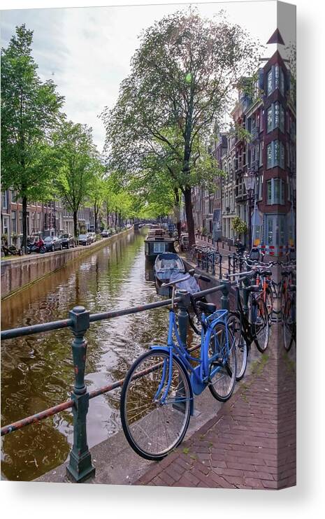 Travel Canvas Print featuring the photograph Typical buildings, canal and bikes in Amsterdam, Netherlands #4 by Elenarts - Elena Duvernay photo