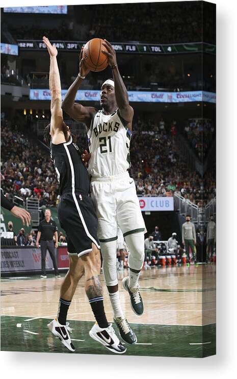 Playoffs Canvas Print featuring the photograph Jrue Holiday by Gary Dineen