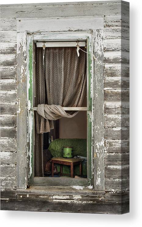 Abandoned Canvas Print featuring the photograph A Glimpse Back - view through broken window of abandoned ND farmstead by Peter Herman
