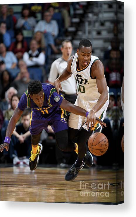 Smoothie King Center Canvas Print featuring the photograph Alec Burks and Jrue Holiday by Garrett Ellwood