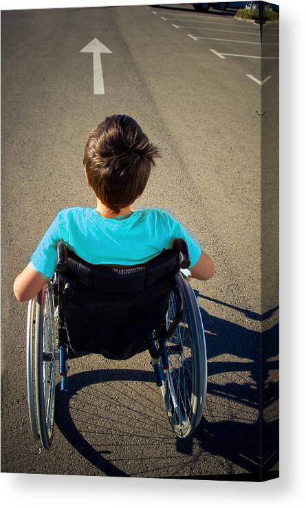 Problems Canvas Print featuring the photograph Boy In Wheelchair Goes Ahead by By Ana Gassent