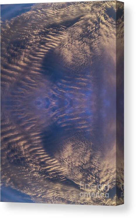 Clouds Canvas Print featuring the digital art Bronze colored clouds in the dark blue sky by Adriana Mueller