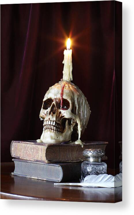 Spooky Canvas Print featuring the photograph Candle and Skull on Books by Jeffrey Coolidge