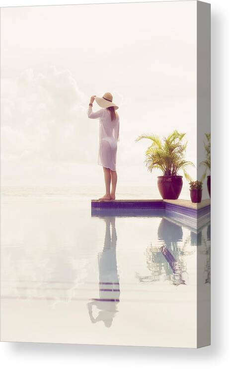 Tranquility Canvas Print featuring the photograph Caucasian woman admiring view from swimming pool by Jacobs Stock Photography Ltd