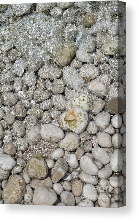 Coast Canvas Print featuring the photograph Clear sea water flowing over white stones 1 by Adriana Mueller