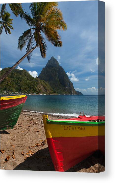 Tranquility Canvas Print featuring the photograph Colorful boats on the beach in Soufrieire, St Lucia with the Pitons in the background.The famous Pitons of St Lucia are volcanic plugs rising out of the sea at the south end of the island. by Reed Kaestner