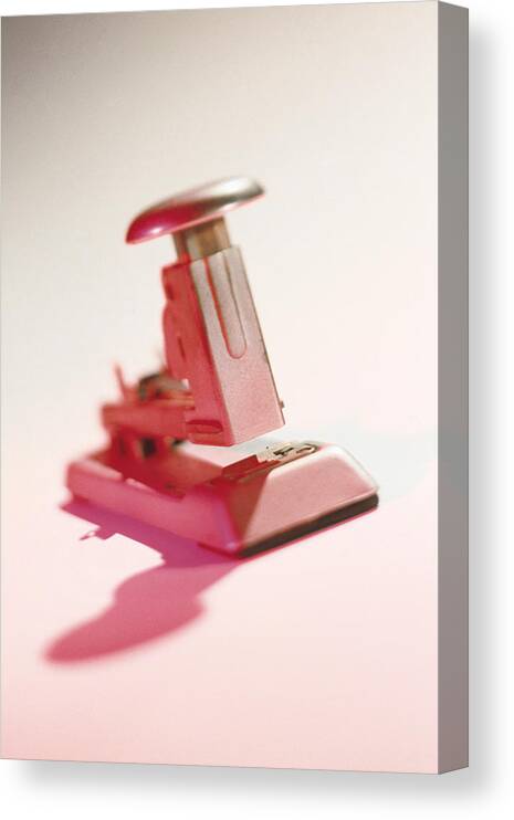 Single Object Canvas Print featuring the photograph Heavy duty stapler by Comstock