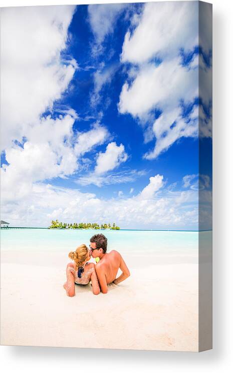 Young Men Canvas Print featuring the photograph Kissing in the tropical paradise by AleksandarNakic