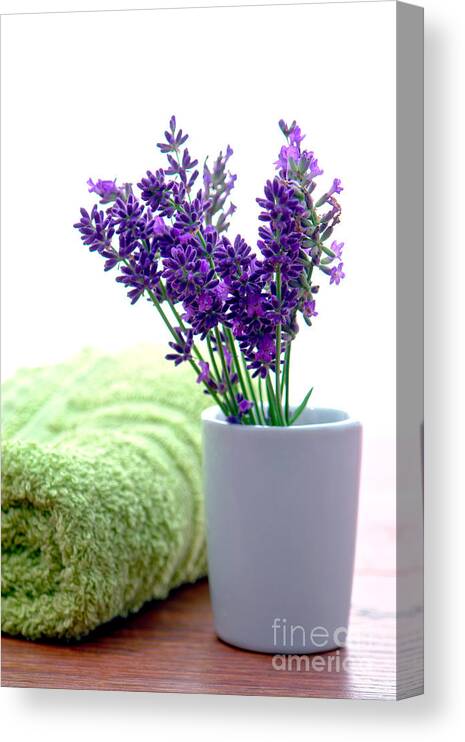 Aromatherapy Canvas Print featuring the photograph Lavender Flowers and Bath Towel in a Spa by Olivier Le Queinec