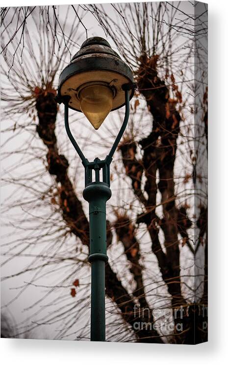 Lantern Canvas Print featuring the photograph Old rusty lantern and gloomy sky by Mendelex Photography