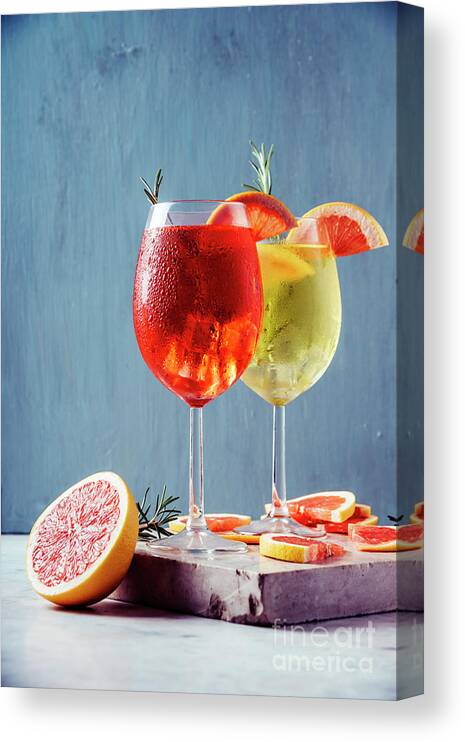 Aperol Canvas Print featuring the photograph Red and white aperol spritz garnish in wine glasses by Jelena Jovanovic