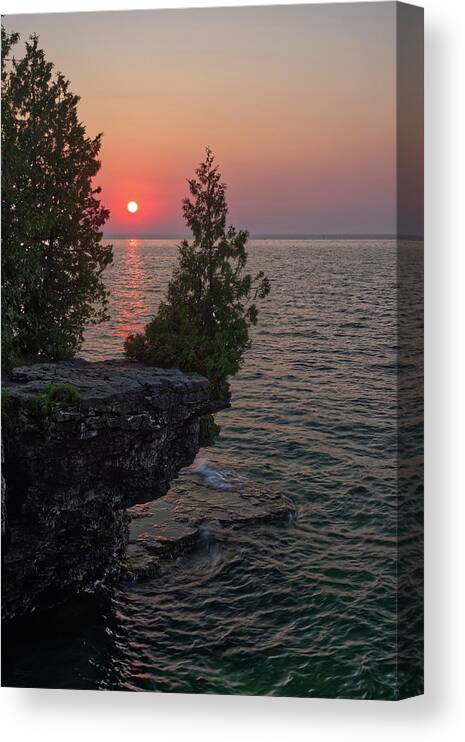 Cave Point Canvas Print featuring the photograph The Sentinel Cedar - the iconic cedar watching over Lake Michigan at Cave Point 2 - Door County WI by Peter Herman