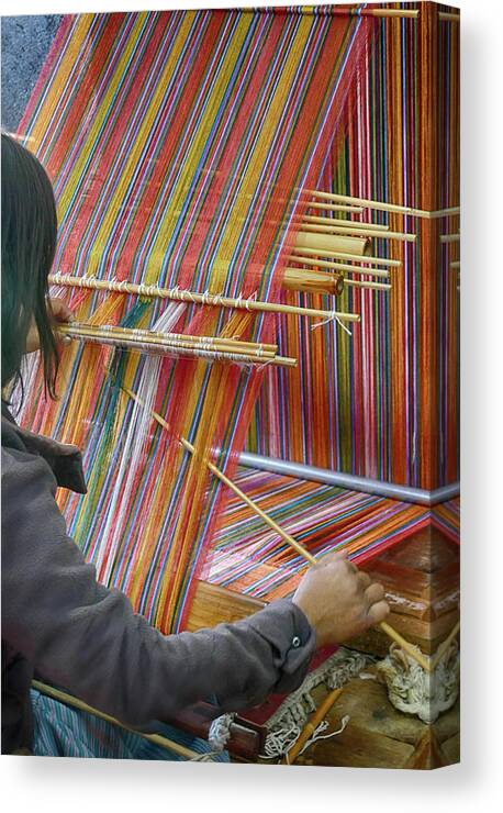 Bhutan Canvas Print featuring the photograph Young woman working a backstrap loom by Steve Estvanik