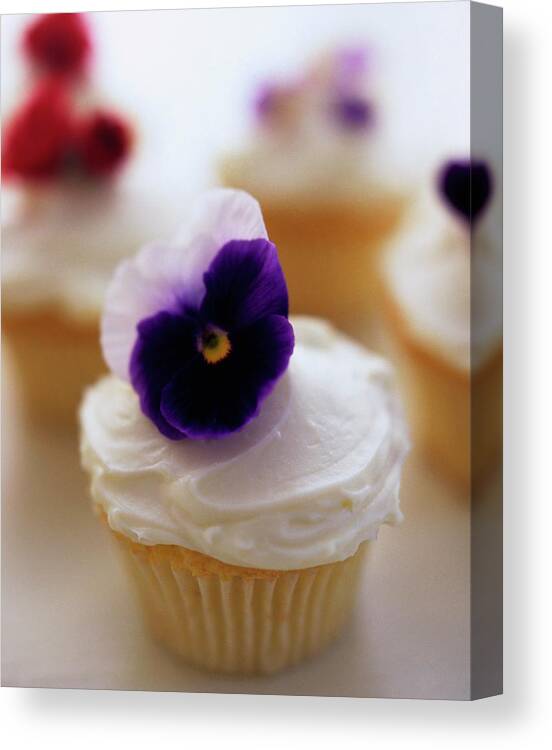 Bridal Canvas Print featuring the photograph A Cupcake With A Violet On Top by Romulo Yanes