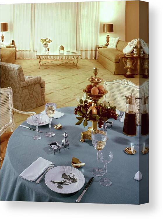 Indoors Canvas Print featuring the photograph A Dining Room With A Blue Tablecloth And Ornate by Wiliam Grigsby