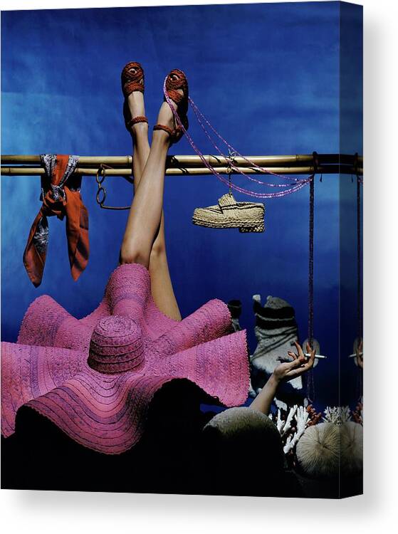 Fashion Canvas Print featuring the photograph A Model Wearing A Pink Hat by John Rawlings
