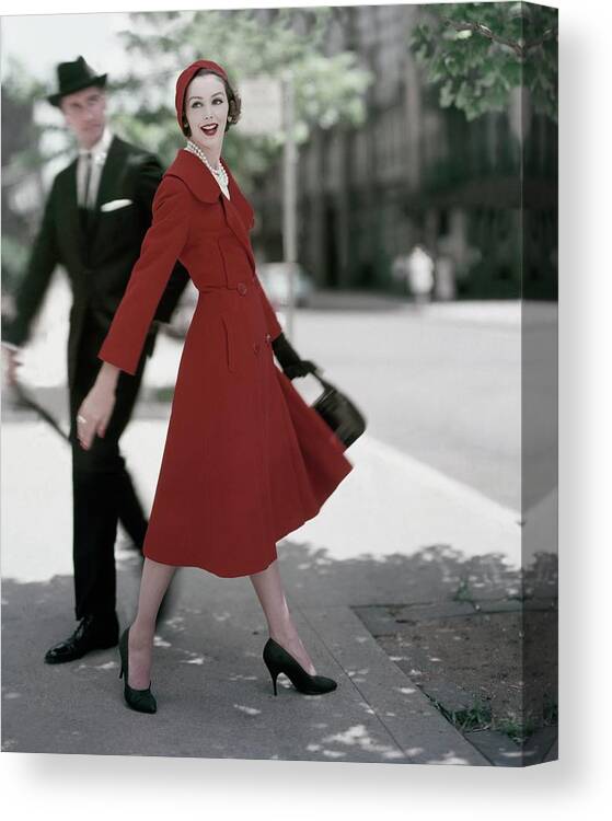 Fashion Canvas Print featuring the photograph A Model Wearing A Red Coat by Karen Radkai