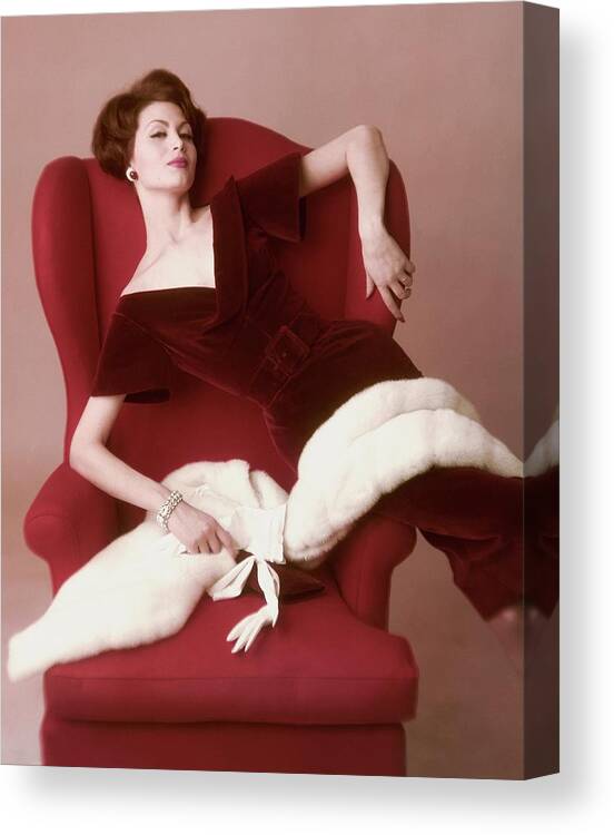Fashion Canvas Print featuring the photograph A Model Wearing A Red Velvet Dress by John Rawlings