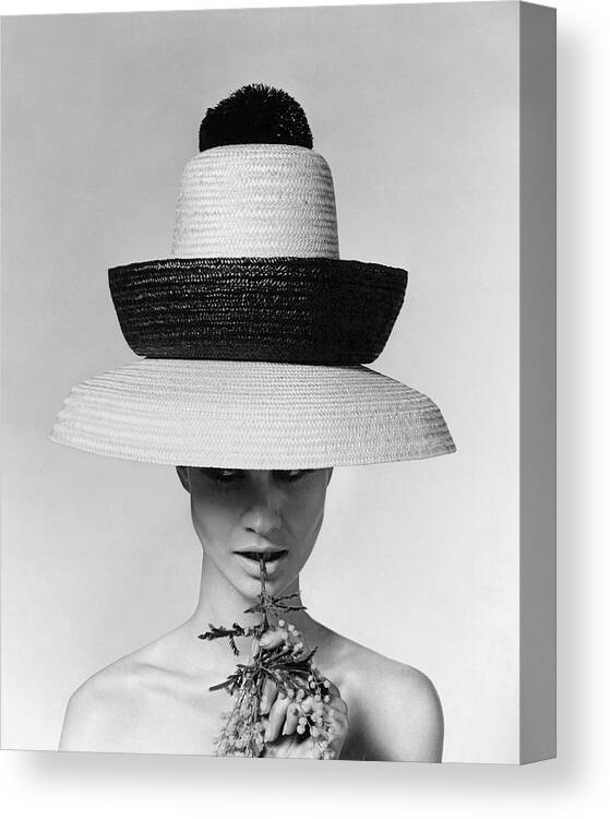 Accessories Canvas Print featuring the photograph A Model Wearing A Sun Hat by Karen Radkai