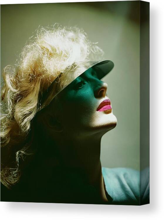 Health Canvas Print featuring the photograph A Model Wearing A Sun Shade by Erwin Blumenfeld