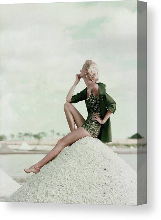 Exterior Canvas Print featuring the photograph A Model Wearing A Swimsuit And Jacket by Leombruno-Bodi