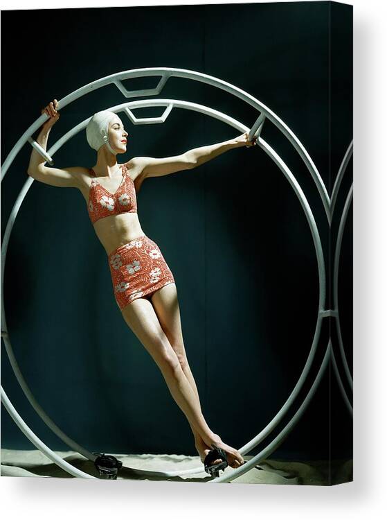 Swimwear Canvas Print featuring the photograph A Model Wearing A Swimsuit In An Exercise Ring by John Rawlings