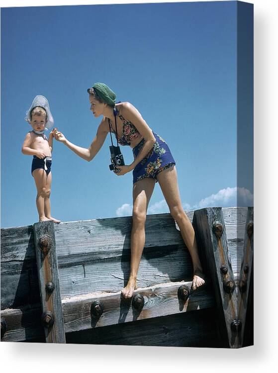Children Canvas Print featuring the photograph A Mother And Son On A Pier by Toni Frissell