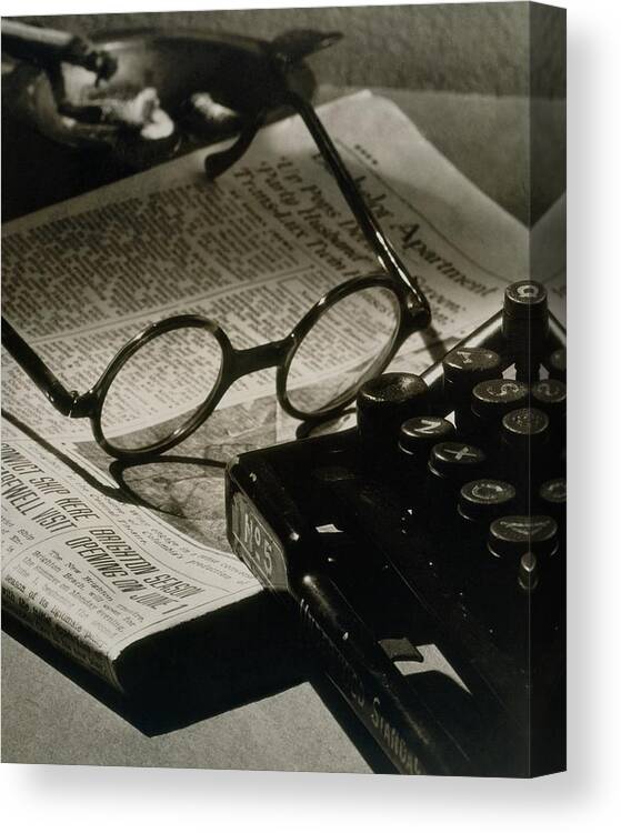 Literary Canvas Print featuring the photograph A Pair Of Glasses On Top Of A Newspaper by Irving Browning