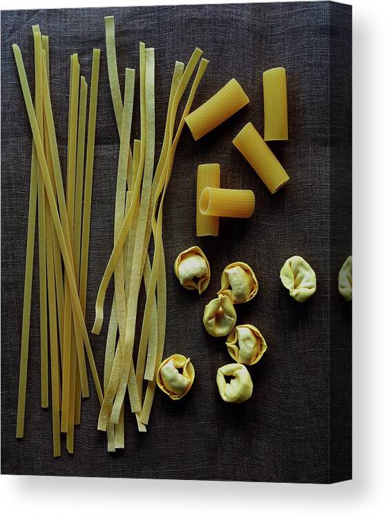Cooking Canvas Print featuring the photograph A Selection Of Uncooked Pasta by Romulo Yanes