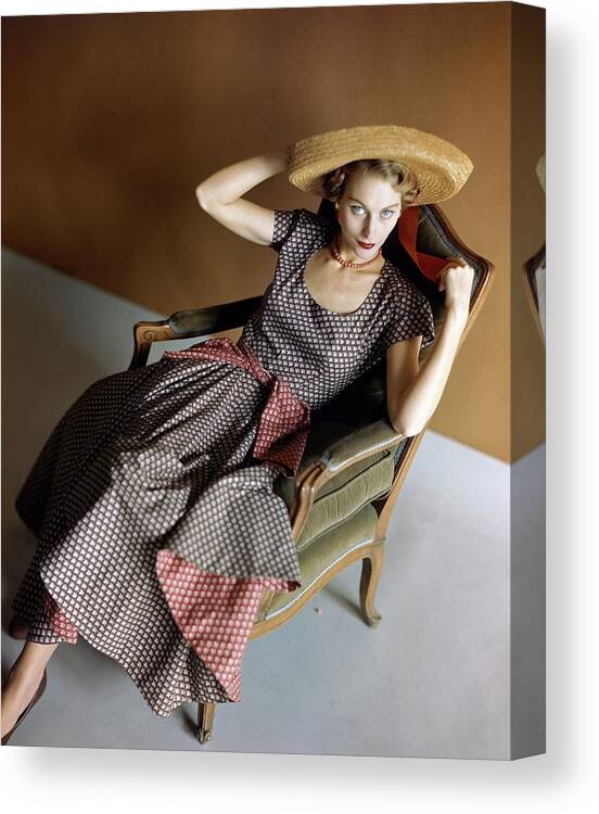 Accessories Canvas Print featuring the photograph A Woman Wearing A Patterned Dress Sitting In An by Horst P. Horst