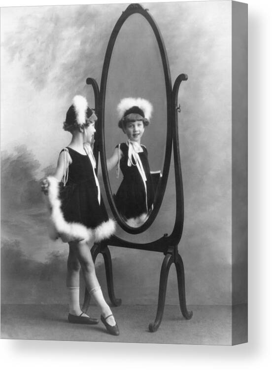 1035-692 Canvas Print featuring the photograph A Young Girl In A Mirror by Underwood Archives