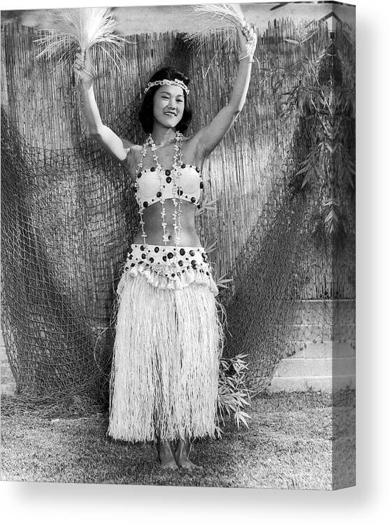 1 Person Canvas Print featuring the photograph A Young Hawaiian Hula Woman by Underwood Archives