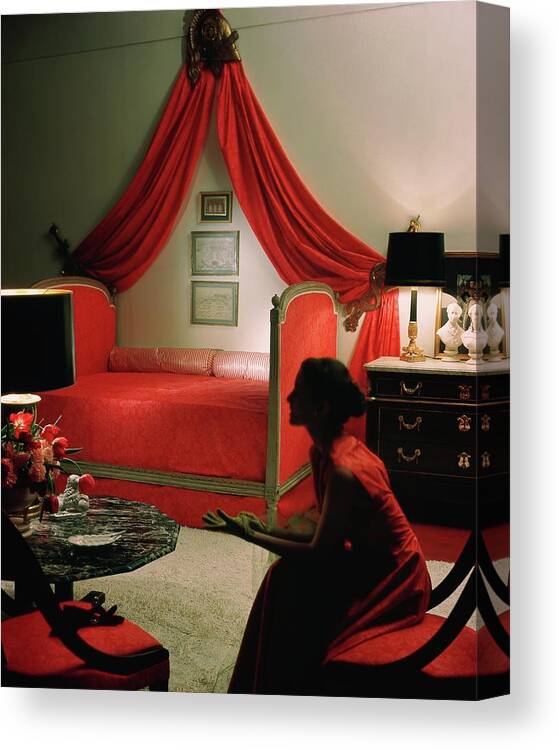 One Person Canvas Print featuring the photograph A Young Woman Sitting In A Red Bedroom by Horst P. Horst