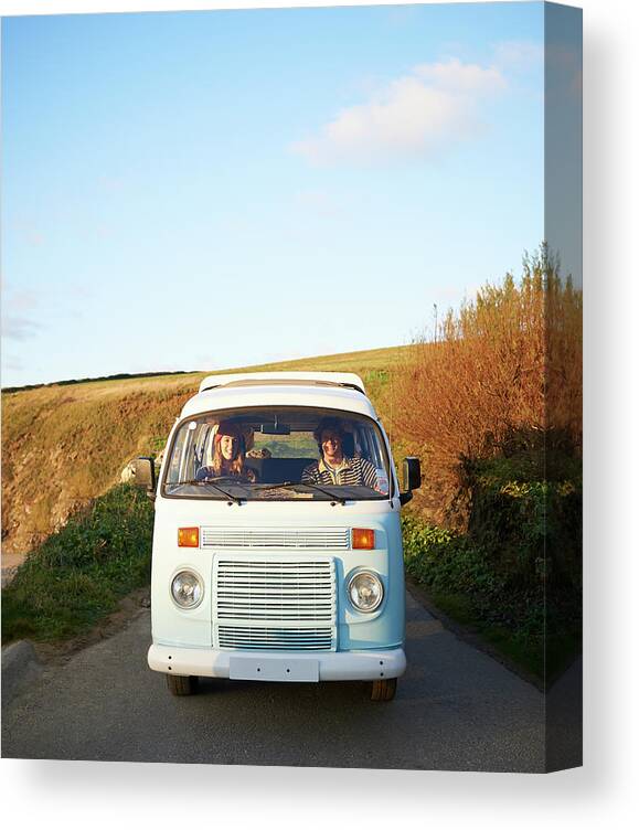 People Canvas Print featuring the photograph Couple Driving Camper Van Along Coastal by Dougal Waters