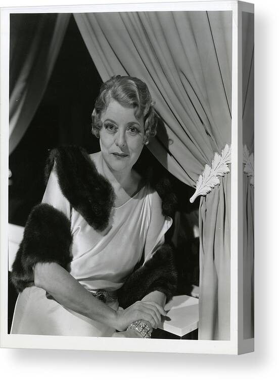 Actress Canvas Print featuring the photograph Mary Bowland Wearing A Satin Gown And A Fur Wrap by George Hoyningen-Huene