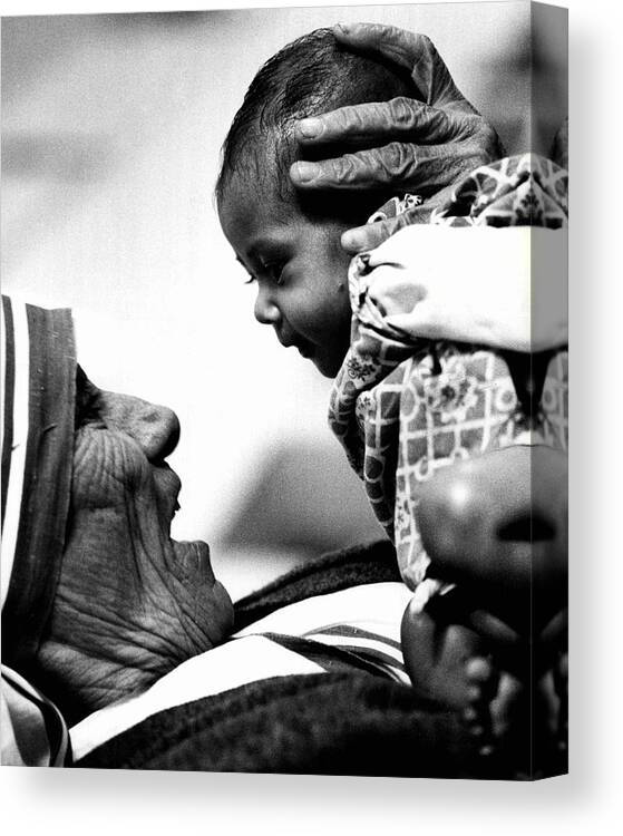 Classic Canvas Print featuring the photograph Mother Teresa Holds Baby by Retro Images Archive