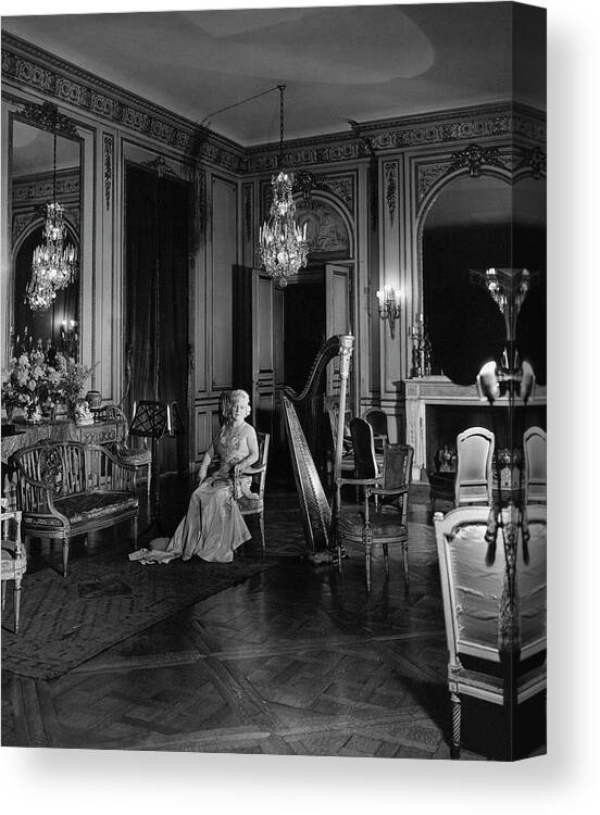 Home Canvas Print featuring the photograph Mrs. Cornelius Sitting In A Lavish Music Room by Cecil Beaton