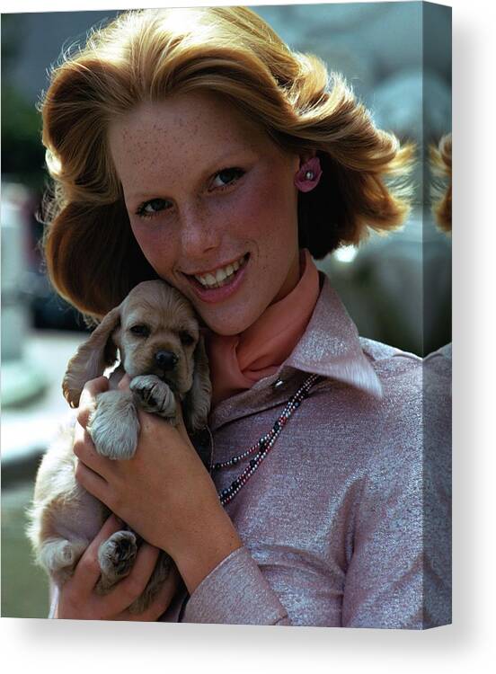 Accessories Canvas Print featuring the photograph Patti Hansen Carrying A Puppy by William Connors