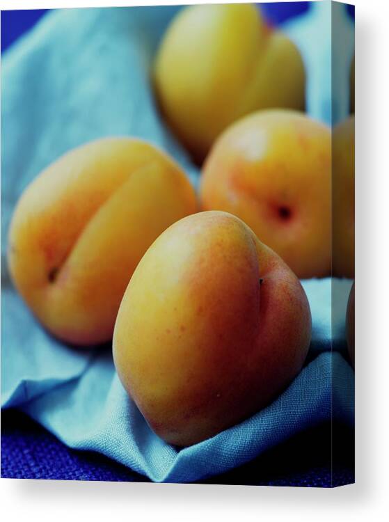 Fruits Canvas Print featuring the photograph Plumcots by Romulo Yanes