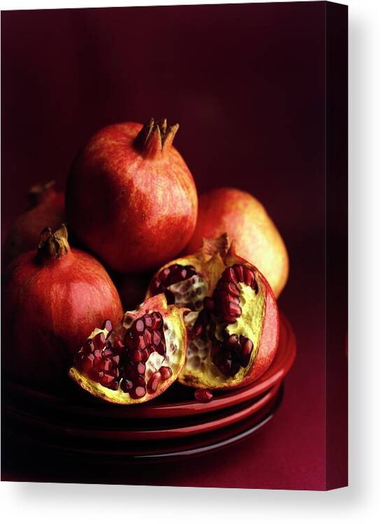 Fruits Canvas Print featuring the photograph Pomegranates by Romulo Yanes
