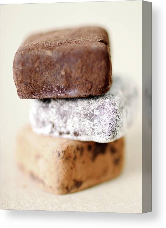 White Background Canvas Print featuring the photograph Studio Shot Of Truffle Candies by Johner Images