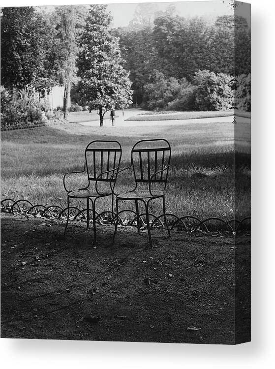 Champs-elysees Canvas Print featuring the photograph Two Chairs Near The Champs Elysees by Erwin Blumenfeld