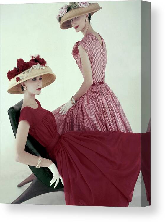Fashion Canvas Print featuring the photograph Two Models Wearing Red Dresses by Karen Radkai