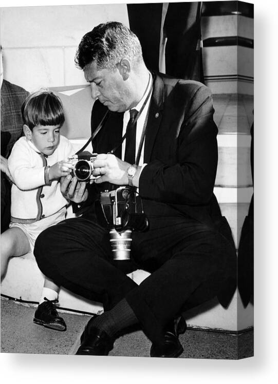 History Canvas Print featuring the photograph John F. Kennedy Jr. Takes An Interest by Everett