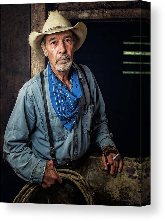 Cowboy Canvas Print featuring the photograph A Rugged Soul by Ron McGinnis
