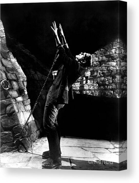 Frankensteins Monster Chained The Castle Played By Boris Karloff Canvas Print featuring the photograph Frankensteins Monster chained the castle played by Boris Karloff by Vintage Collectables
